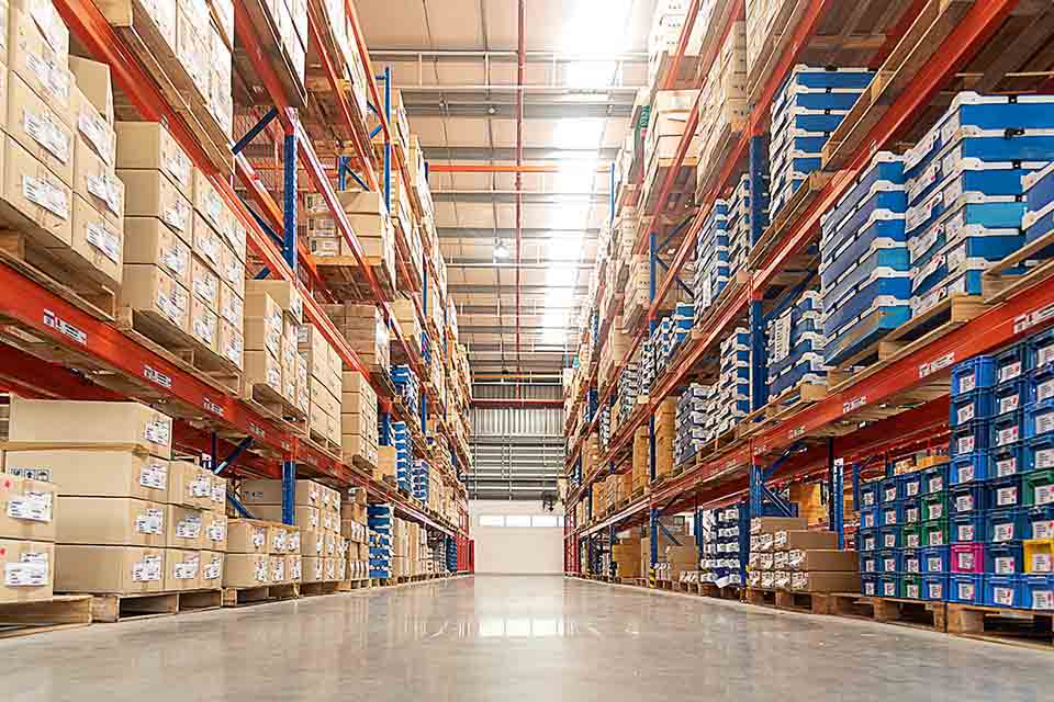 Rows of shelves with goods boxes in huge distribution .warehouse Rows of shelves with goods boxes in huge distribution
warehouse at industrial storage factory.